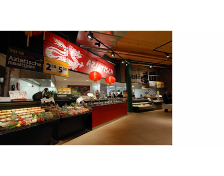 Studio Königshausen's retail design for Jumbo Supermarket in Breda, The Netherlands, aims to enhance the food shopping experience. Jumbo, a family-owned supermarket chain, wanted to elevate food preparation and enjoyment in their stores while maintaining affordability and convenience.